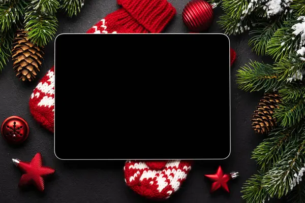 Tablet with blank screen and Christmas decor. Xmas device screen template