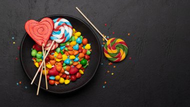 Various candy sweets and lollipops. Flat lay with copy space