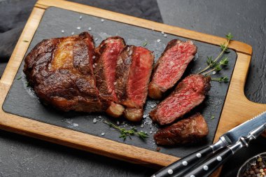 Deliciously juicy sliced beef ribeye steak, perfectly cooked and ready to be savored