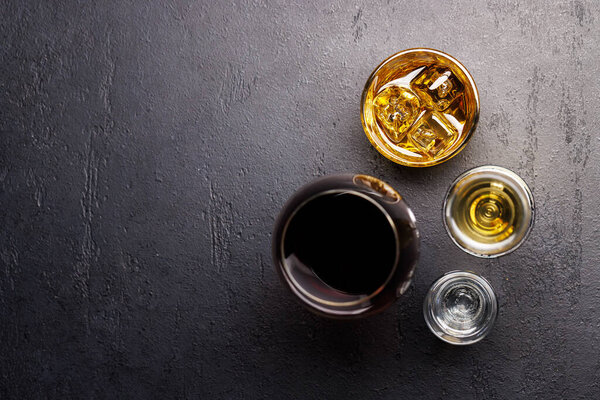 Whiskey, wine, champagne drinks, elegant and enticing. Flat lay with copy space