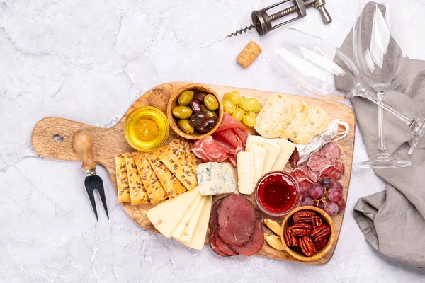 Antipasto Board Prosciutto Salami Crackers Cheese Olives Nuts Flat Lay — Stock Photo, Image