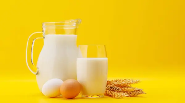 Pitcher Milk Eggs Yellow Background Copy Space — Stok Foto