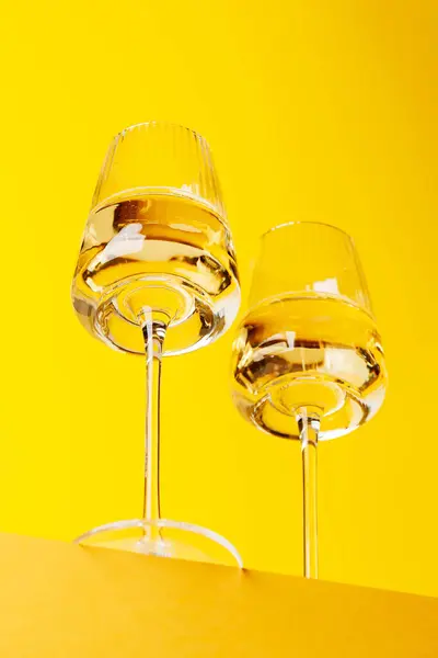 Champagne Elegance Glasses Sparkling Wine Vibrant Yellow Background Copy Space — Stock Photo, Image