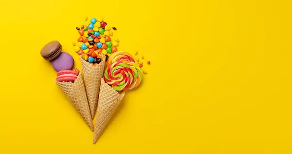 Various Colorful Candies Lollipops Macaroons Flat Lay Sweets Yellow Background — Stock Photo, Image