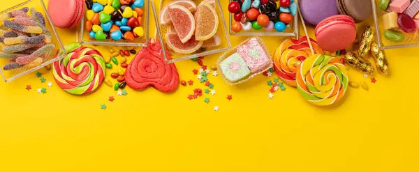 Various Colorful Candies Lollipops Macaroons Flat Lay Yellow Background Copy — Stock Photo, Image