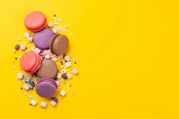 Various Colorful Macaroons Flat Lay Yellow Background Copy Space Stock Picture