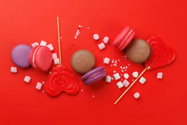 Various Colorful Candies Lollipops Macaroons Flat Lay Red Background — Stock Photo, Image