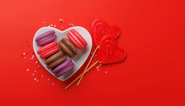 Various Colorful Macaroons Heart Shaped Bowl Love Sweets Red Background Stock Picture