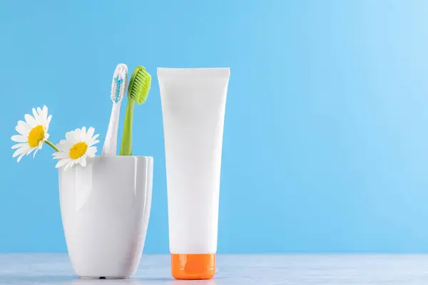 stock image A clean and refreshing image featuring toothpaste and toothbrushes, promoting oral hygiene and a bright smile