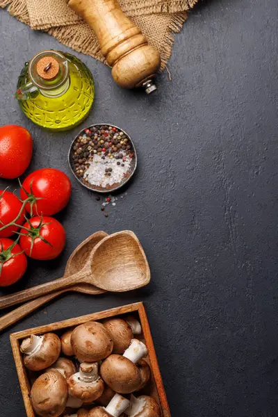 stock image Spices, olive oil, ingredients and utensils on cooking table. Flat lay with copy space