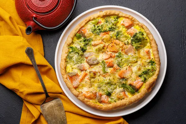 stock image Fresh fish homemade pie with salmon and broccoli. Flat lay