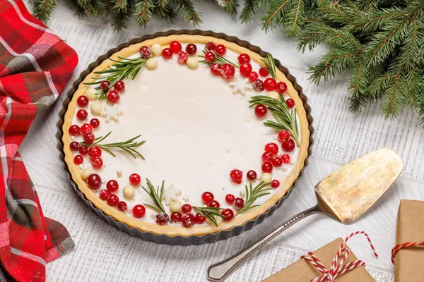 stock image Festive indulgence: Christmas cake adorned with berries and rosemary