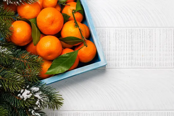 stock image Festive citrus joy: Tangerines in a holiday-themed box, flat lay with copy space