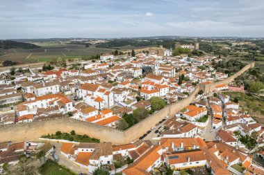 Aerial view of the historic town Obidos, near Peniche, Portugal. Aerial shot of Obidos Medieval Town, Portugal. Aerial view of medieval fortress in Obidos.