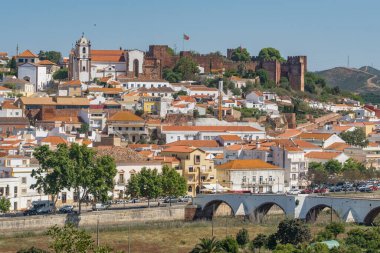 Silves medieval town in Algarve region of Portugal. Silves old town cityscape. Ancient roman bridge, Cathedral church, old fortress and historic buildings