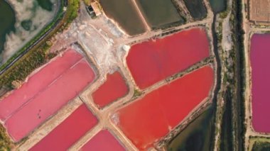 Top down view of the colorful salt ponds near Olhao town, Southern Portugal. Saline marshes on the Ria Formosa lagoon in Tavira, Algarve, Portugal. Salt production in Algarve region