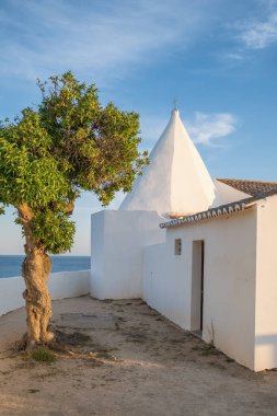 Senhora de Nossa church in Algarve region, South Portugal. Chapel Nossa Senhora da Rocha in Portugal at sunset
