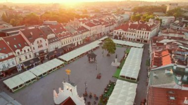 Rzeszow town market square at sunrise. Aerial view of town square in Rzeszow, Poland. Drone footage of the historic Rzeszow old town, largest city in southeastern Poland. Orbit shot