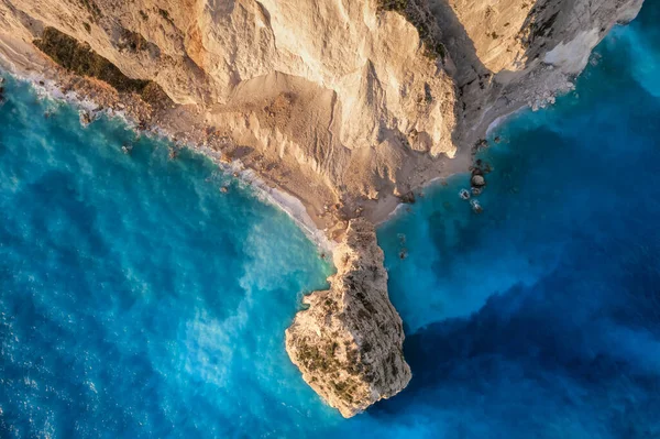 Aerial top down view of Plakaki Rocks on Zakynthos Island, Ionian sea, Greece. Rocky coastline of Zakynthos Island near Plakaki beach. Ionian Sea with turquoise water and limestone cliffs , Greece.