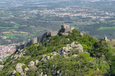 View of the Moorish Castle, also known as Castelo dos Mouros, on the hilltop overlooking the old town of Sintra in Portugal.