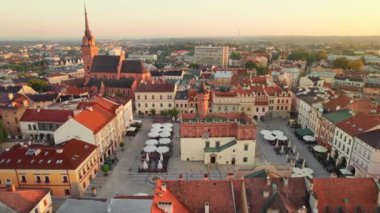 City Hall on main city square in Tarnow old town, Malopolskie voivodeship, Poland. Aerial view of the Tarnow market square at sunrise. Rynek square, cathedral and historic buildings at sunny morning.