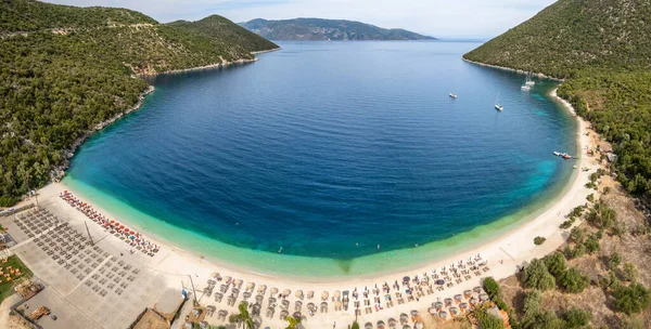 stock image Panorama of Antisamos beach with crystal clear azure water on Kefalonia island, Greece. Aerial view of the paradise beach with sunbeds on Kefalonia island, Ionian island, Greece.