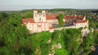 Benedictine abbey in Tyniec near Krakow in summer, Poland. Monastery and church on the rocky cliff at Vistula river. Aerial view at sunset.