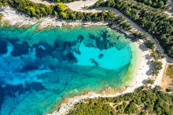 Stock image Aerial view of an amazing sea bay with beautiful Emplisi beach near Fiskardo town, Kefalonia island, Ionian sea, Greece. Aerial drone orbit shot. Perfect summer holidays destination