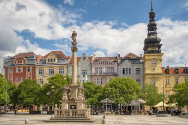 Ostrava, Czech Republic - June 14, 2022: Masaryk Square in Ostrava old town. Ostrava Museum, Marian Plague Column and the colourful facades of historic buildings in Ostrava city center.