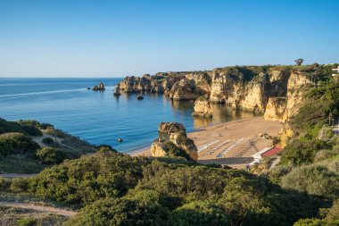 Praia de Dona Ana beach near Lagos town, Algarve, Portugal. Praia Dona Ana beach with turquoise sea water and cliffs, Portugal