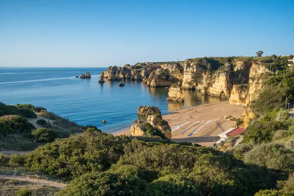 Praia de Dona Ana beach near Lagos town, Algarve, Portugal. Praia Dona Ana beach with turquoise sea water and cliffs, Portugal