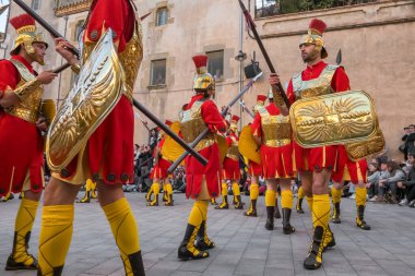 Verges, Spain - March 29: Good Friday parade, Roman soldiers marching during Holy Week or Semana Santa in Verges, Girona province, Catalonia, Spain.  clipart