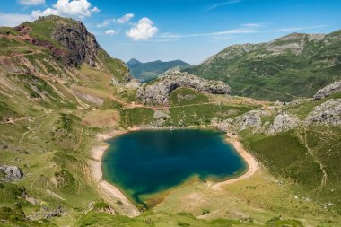 Lago de Calabazosa o Negro lake in the Somiedo national park, Asturias, Spain. Aerial view of the Saliencia mountain lakes surrounded by the beautiful landscapes of the Asturias region, northern Spain clipart