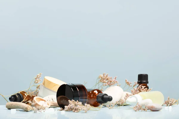 Composition Bottles Essential Oils Facial Serum Creams Table Stones Flowers — Zdjęcie stockowe