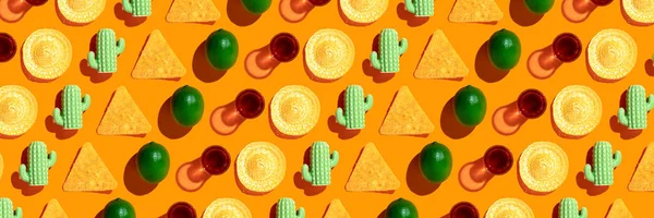 Mexican style pattern on orange background. Mexican food concept. Restaurant menu, fiesta, celebration. Lime, sombrero, tequila, cactus, nachos flat lay top view