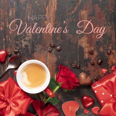 Valentines day greeting card with fresh cup of coffee, red roses, chocolate and gifts. Valentines day concept. Top view.