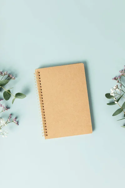 Notebook Flowers Blue Background Flat Lay Top View Copy Space — Zdjęcie stockowe