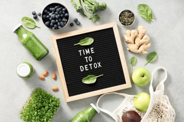 Time to detox letter board quote flat lay. Green smoothie and Healthy ingredients. Healthy eating concept clipart