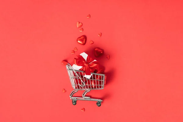 Shopping Trolley Gift Boxes Roses Chocolate Red Hearts Red Background — Photo