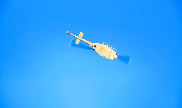 Safety emergency helicopter flying to rescue, upward view