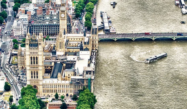 Aerial view of Westminster Palace, Westminster Bridge over River Thames from a high vantage point.