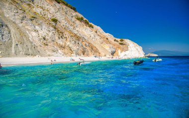 Skiathos, Greece - June 30, 2022: Famous Lalaria beach in Skiathos with tourists.