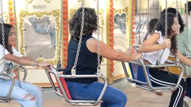 Three Young Girls Ride Wave Swinger — Stock Video