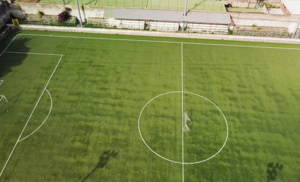Aerial view of an empty soccer field. Overhead downward 4K footage.