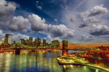 Skyline of New York City at sunset from Manhattan Bridge.