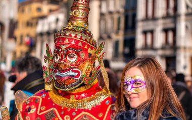 Venice, Italy - February 8th, 2015: People masquerading at the famous Venice Carnival.