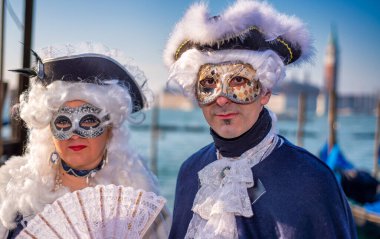 Venice, Italy - February 8th, 2015: People masquerading at the famous Venice Carnival.