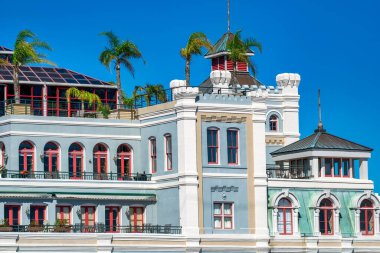 New Orleans colorful building and palms, Louisiana.