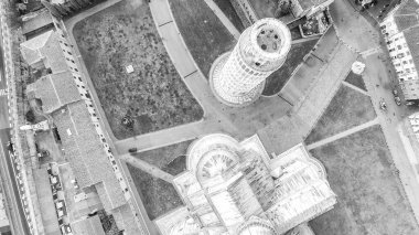 Black and white aerial view of Pisa Cathedral and Tower in Square of Miracles. Piazza del Duomo from drone, Italy.