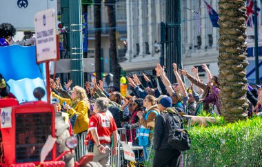 New Orleans, LA - February 9, 2016: Crowd along the city streets for Mardis Gras carnival parade.